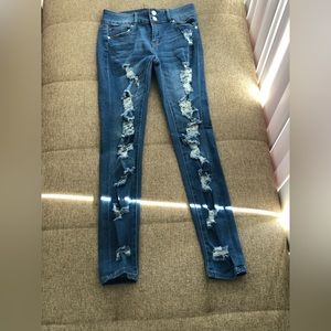 Almost famous blue Jean distressed jeggin’s size 3